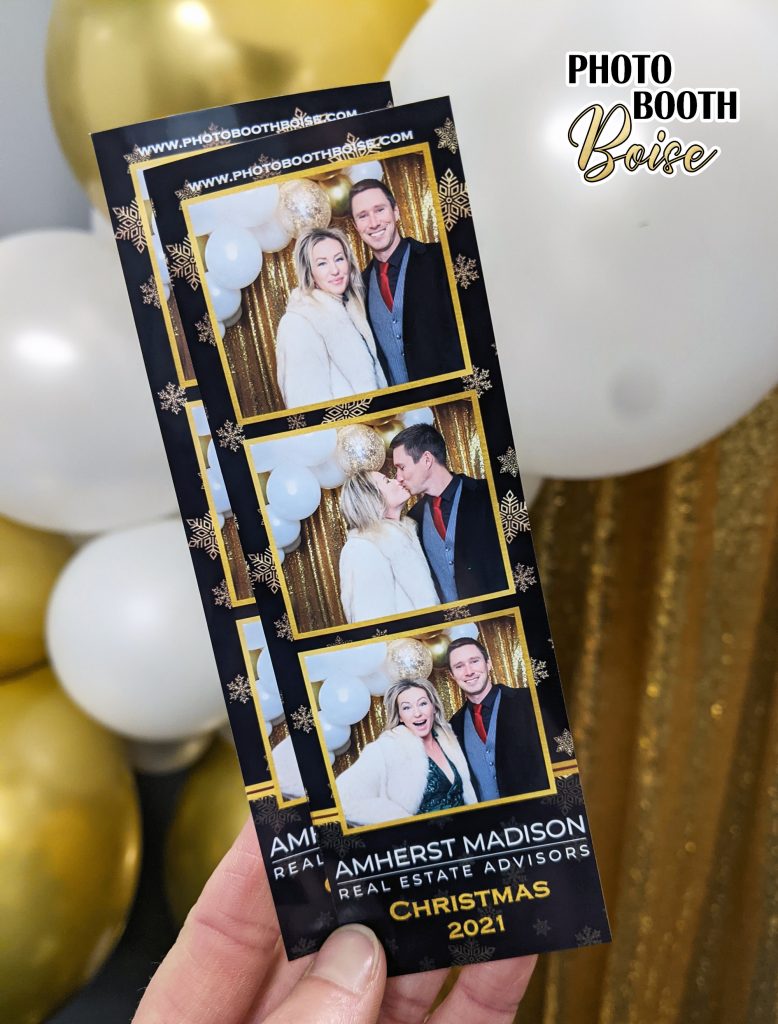 A couple kissing in the photo booth with sparkly backdrop