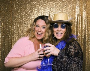 A popular photo is the "cheers" for these two ladies in the photo booth.