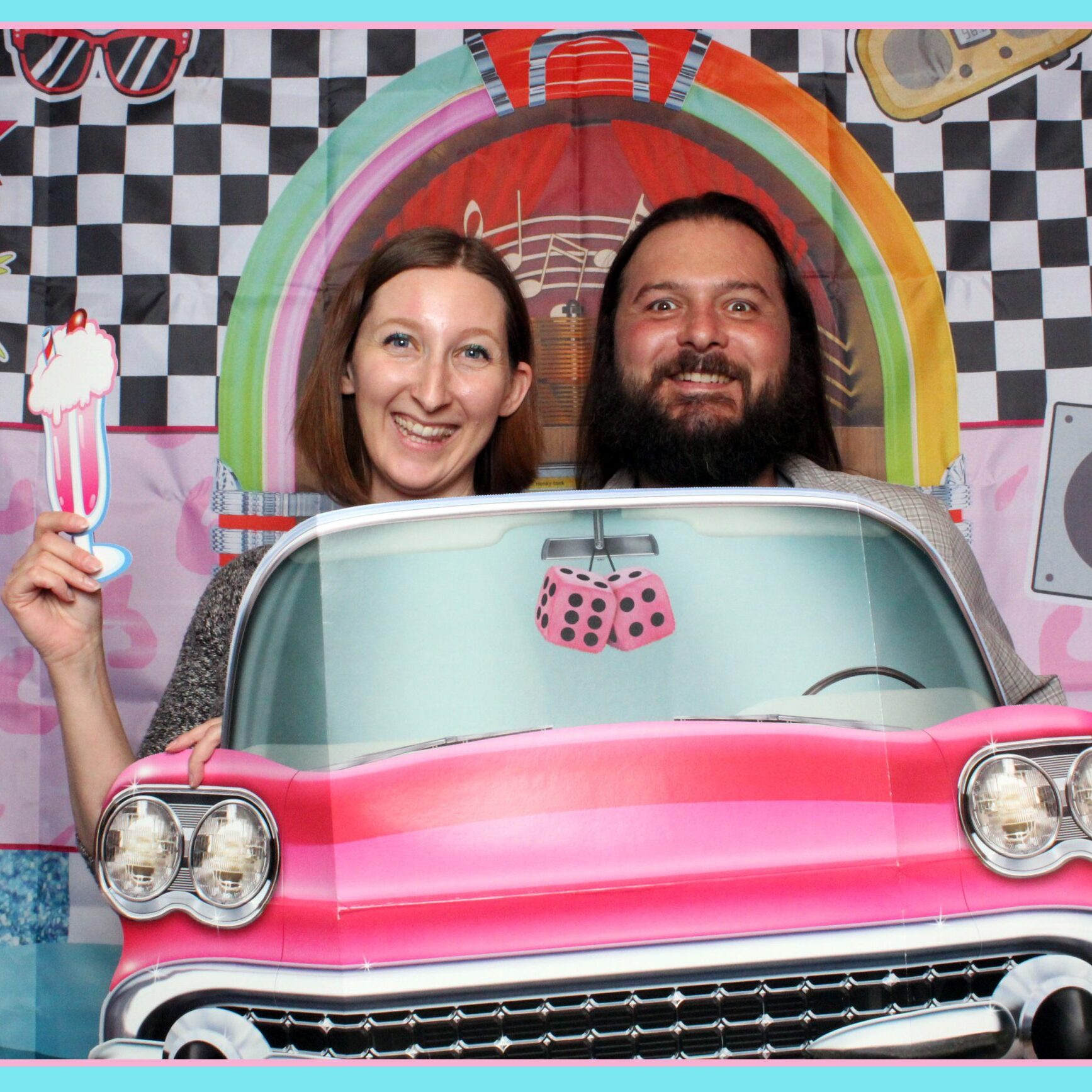 A couple taking a silly photo for National Spouse's Day